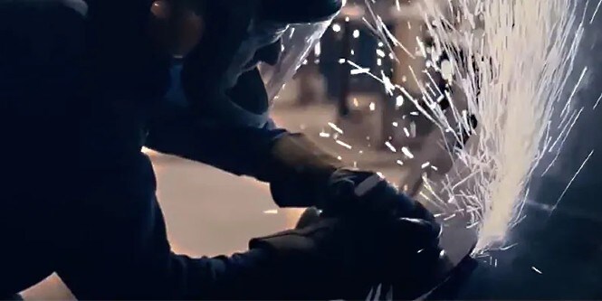 metalworker using abrasive product for welding and metal fabrication	
